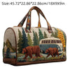 A quilted travel duffle bag with brown leather handles and 3D stitching featuring a forest and bear design.