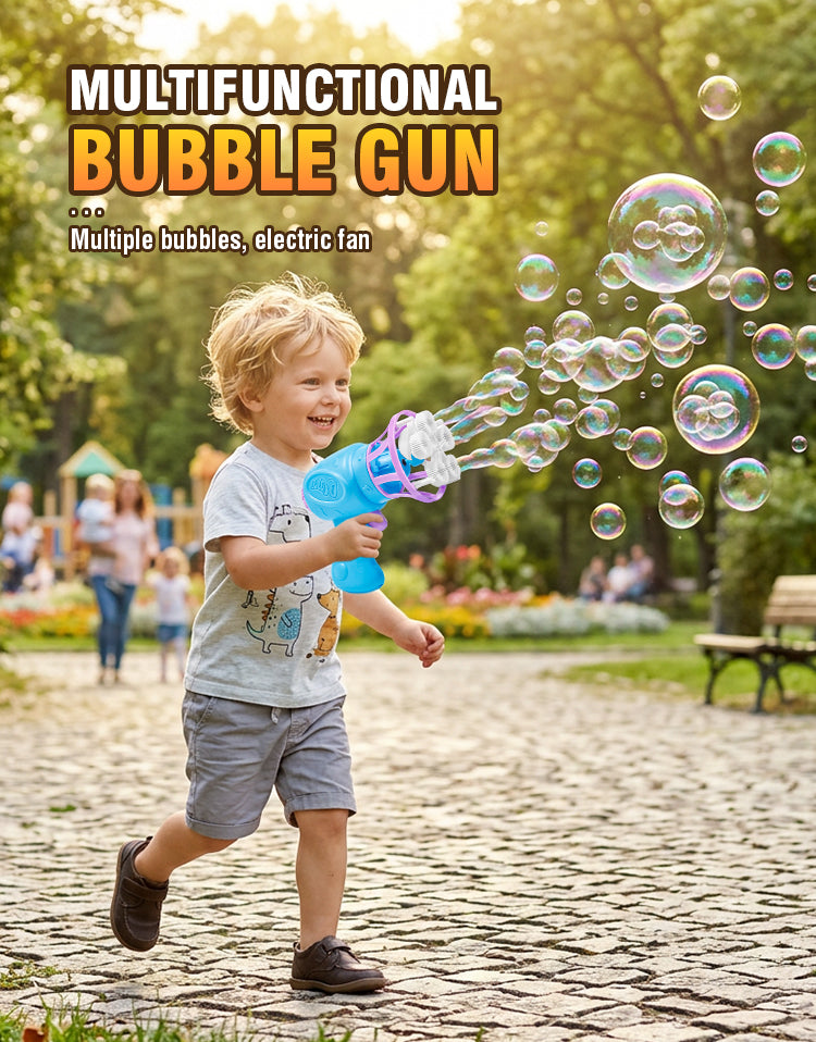 A young boy is joyfully firing a blue bubble gun, creating many bubbles in an outdoor park setting.