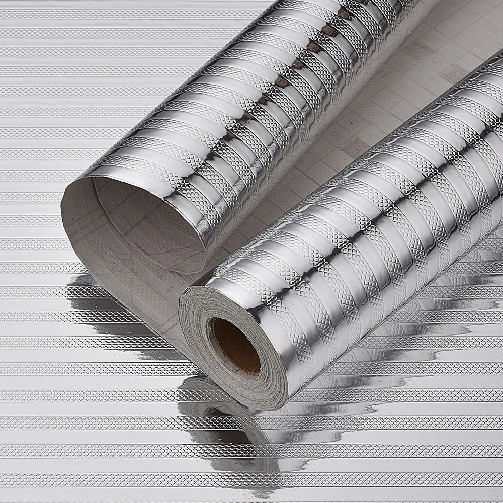 Roll of self-adhesive aluminum foil used as a kitchen backsplash protector