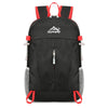 Black ultra-light foldable travel backpack with red accents for hiking and daily use