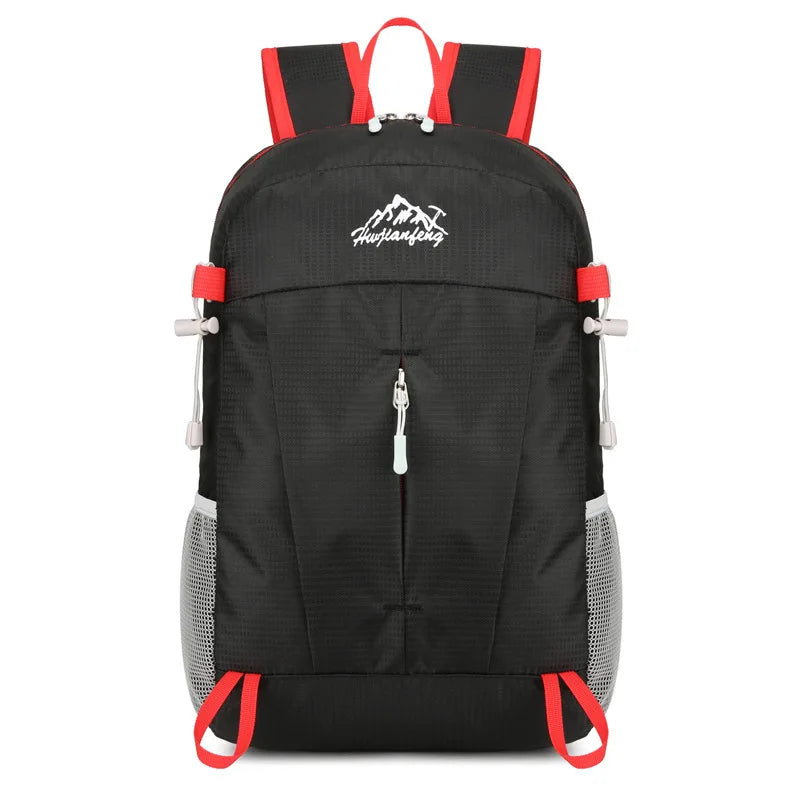 Black ultra-light foldable travel backpack with red accents for hiking and daily use