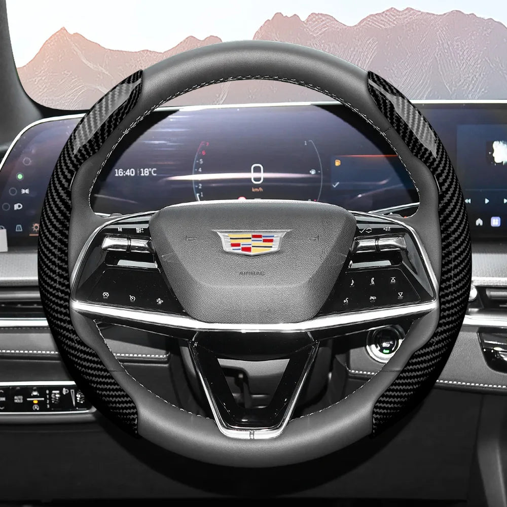 A close-up view of a glossy carbon fiber steering wheel cover inside a car cockpit.