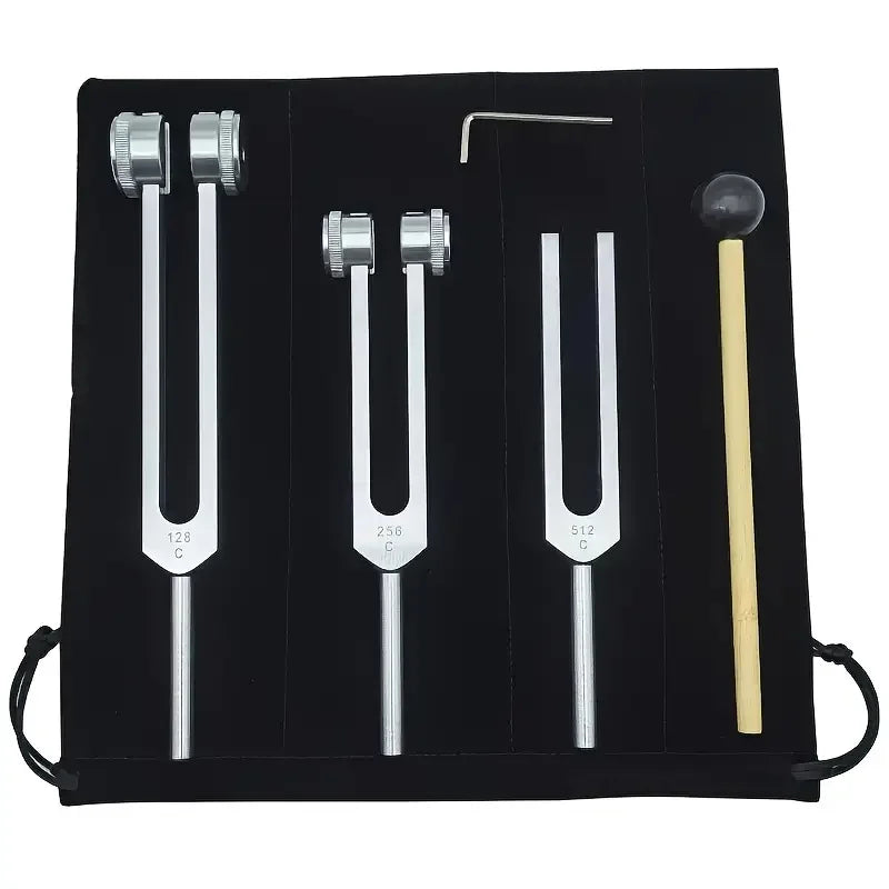 A black case containing a set of tuning forks with various sizes and a mallet for sound therapy.