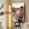 A custom printable canvas wall art photo is displayed next to a tall, glowing light sculpture.