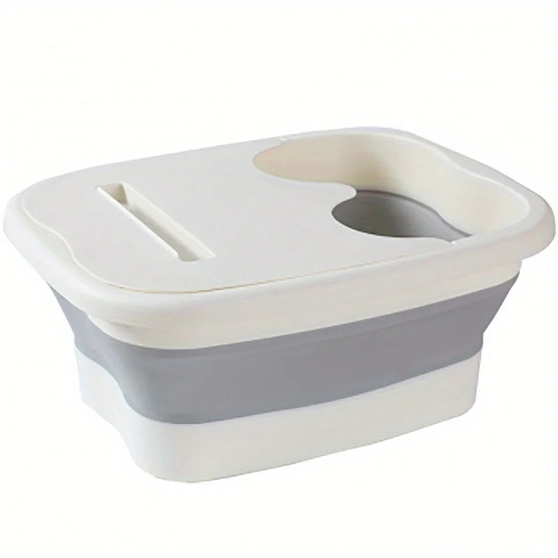A white and gray collapsible foot spa bucket with a removable insert for massage nodules.