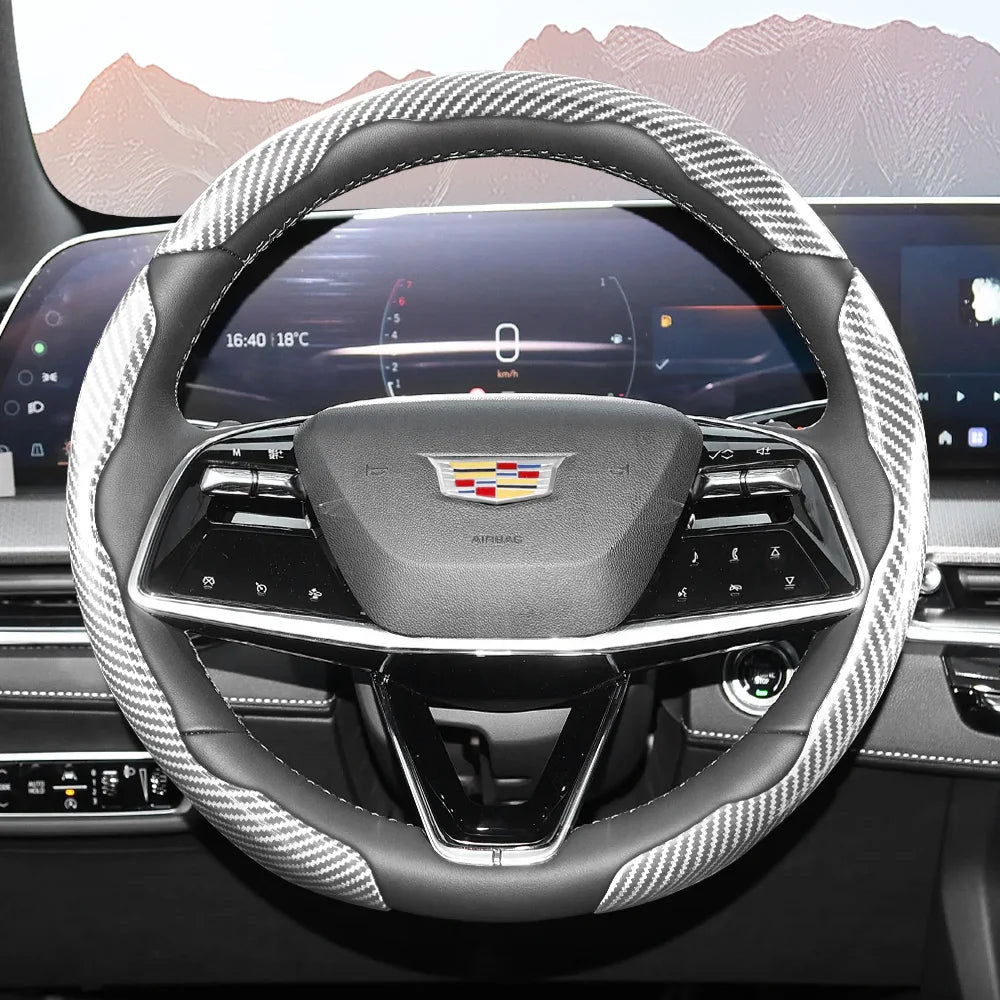Close-up view of a glossy carbon fiber steering wheel cover inside a modern car cockpit.
