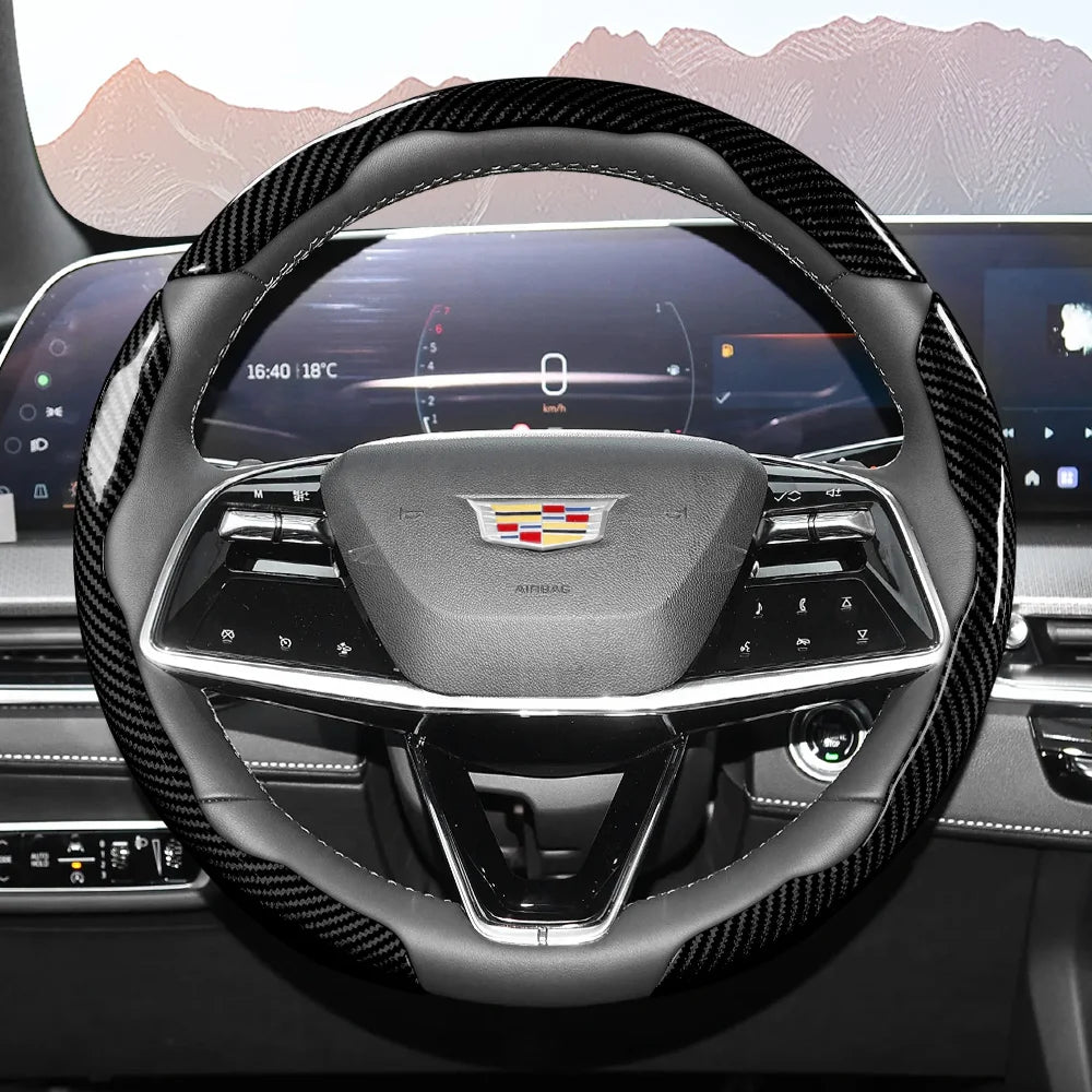 Close-up view of a glossy carbon fiber steering wheel cover inside a modern car cockpit.
