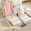 Pink knitted sweater and vacuum storage bags for travel