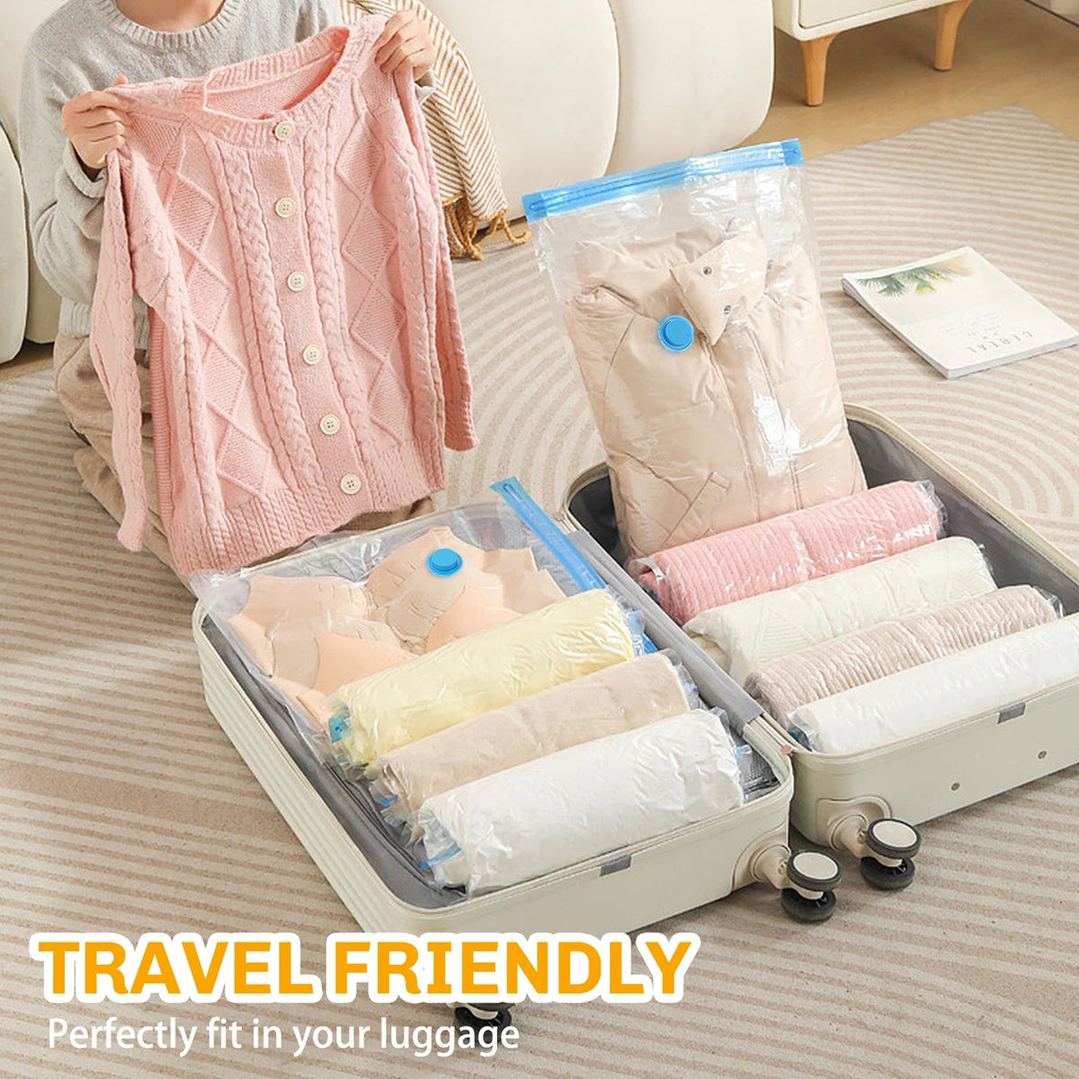 Pink knitted sweater and vacuum storage bags for travel