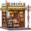 A miniature Japanese bookstore facade featuring signs and a display of books.