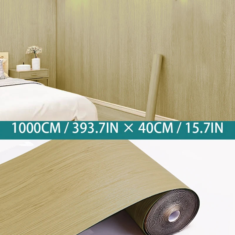 Roll of light wood grain self-adhesive wallpaper in a natural beige color.