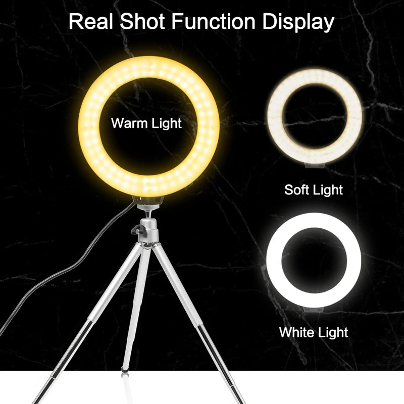 A round LED light panel with three color options Warm Light, Soft Light, and White Light mounted on a tripod.