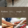 A collection of various wood grain wallpaper rolls in different shades and textures.