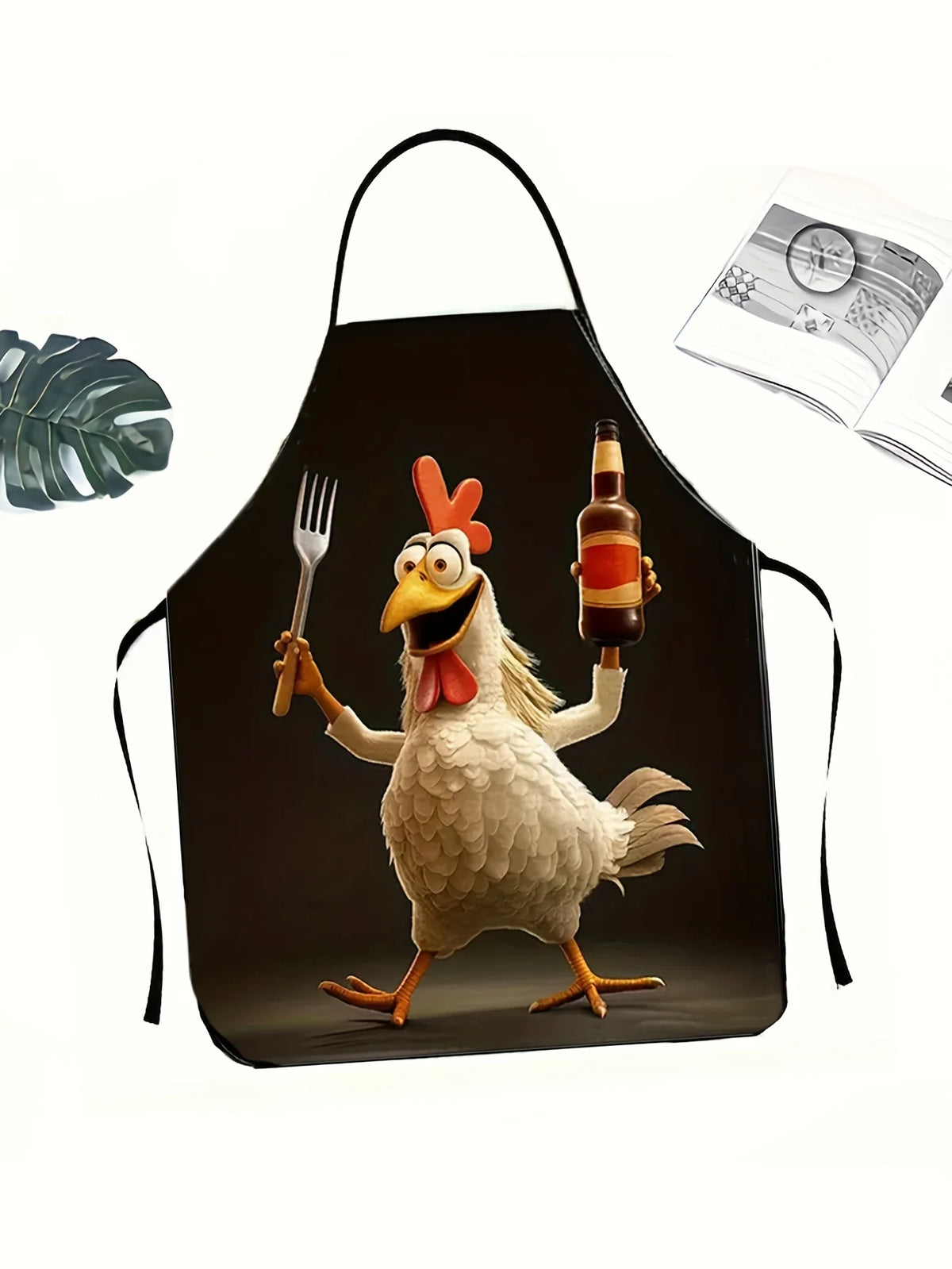 A black apron featuring a graphic illustration of a rooster holding a bottle and a fork.