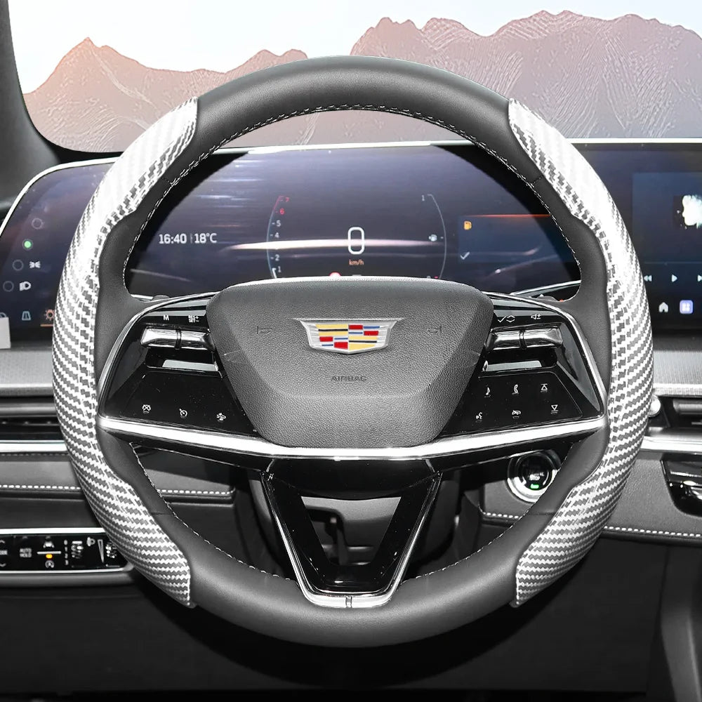Close-up view of a glossy carbon fiber steering wheel cover inside a modern car cockpit.