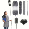 A collection of gray and white microfiber duster brushes with telescopic extension poles.