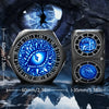 A close-up of a black spinner dice featuring a blue eye design and a separate dual D20 die.