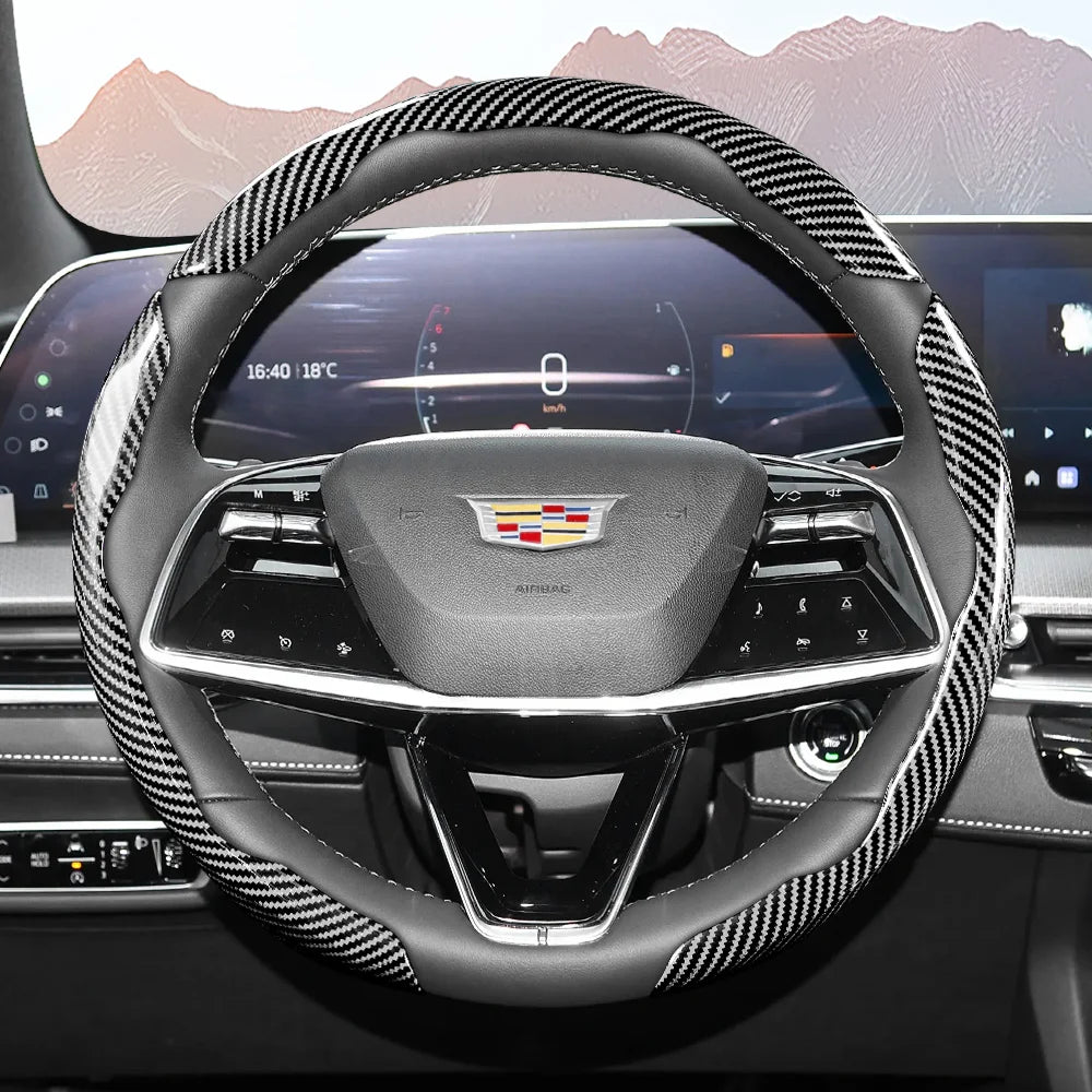 A close-up view of a glossy carbon fiber steering wheel cover inside a car cockpit.
