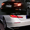 Close-up view of LED rear bumper reflector lights on a black Honda Accord sedan and a white Honda Accord sedan.
