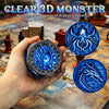 A hand holds a blue 3D monster spinner die with a clear view of the internal structure.