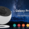 A white Galaxy Projector device is shown against a dark night sky with stars and the moon, highlighting its features.