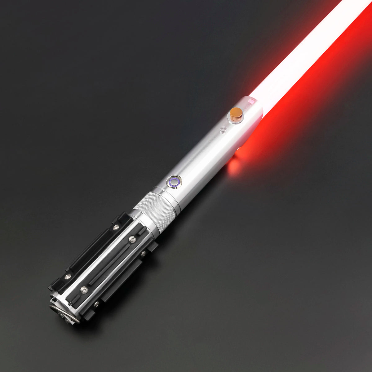 A silver lightsaber with a red glowing blade is shown diagonally against a dark background.
