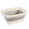Collapsible foot spa bucket with massage nodules in white and gray.