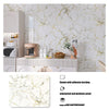A white marble pattern peel and stick self-adhesive wallpaper applied to a wall, displayed next to kitchen appliances.