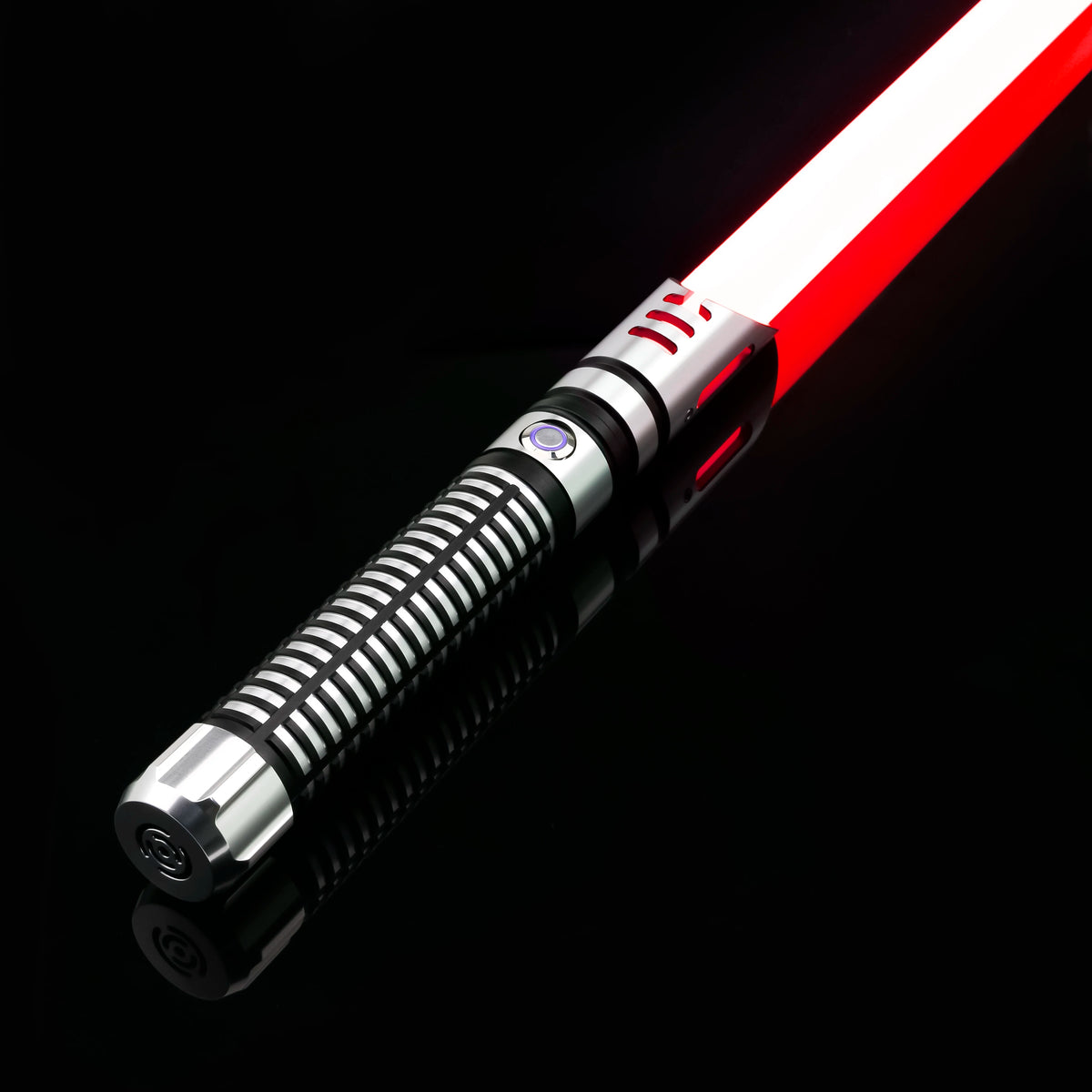 A close-up view of a Neo Pixel lightsaber with a smooth swing and 12 color RGB blade, reflecting on a black surface.