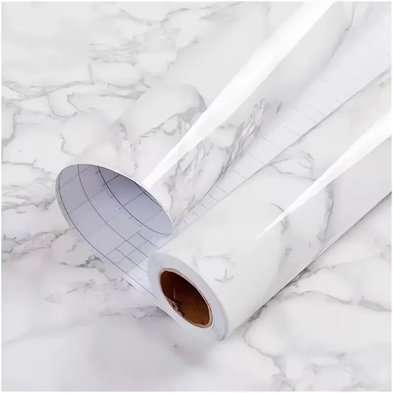 Roll of pearl finish waterproof self-adhesive wallpaper lying on a white marble surface