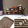 Roll of brown and black striped peel-and-stick wallpaper for interior design