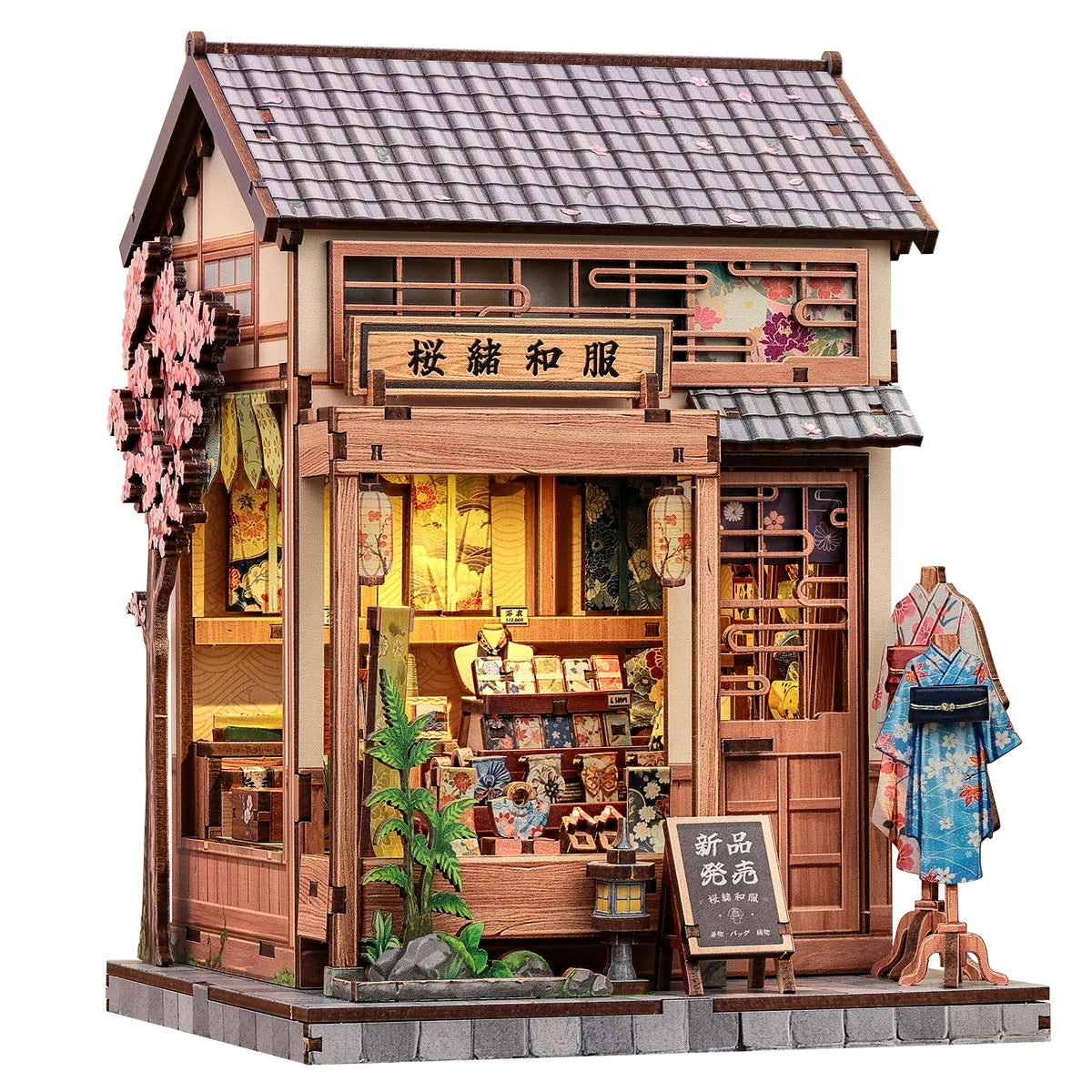 A detailed miniature Japanese book nook kit featuring a traditional wooden storefront with intricate details and lighting.