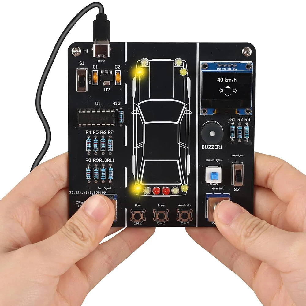 A black electronic circuit board with various components and lights is held in a person's hand.