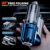 A hand holds a compact, foldable handheld car vacuum cleaner with a blue and silver finish, demonstrating its storage in a ca
