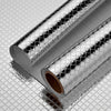 Roll of self-adhesive aluminum foil kitchen wall stickers with a textured, reflective surface.