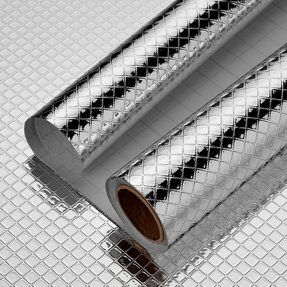 Roll of self-adhesive aluminum foil kitchen wall stickers with a textured, reflective surface.