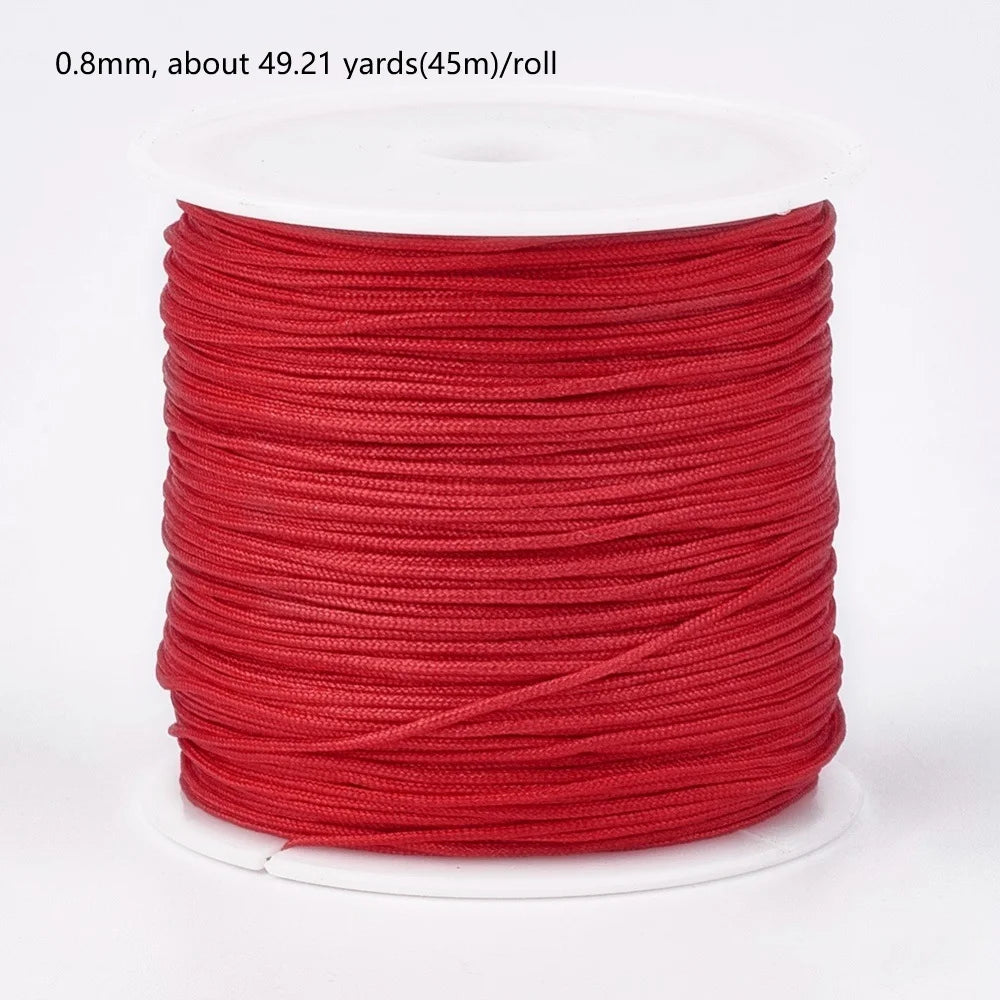 A roll of 0.8mm red nylon cord, approximately 49.21 yards long.