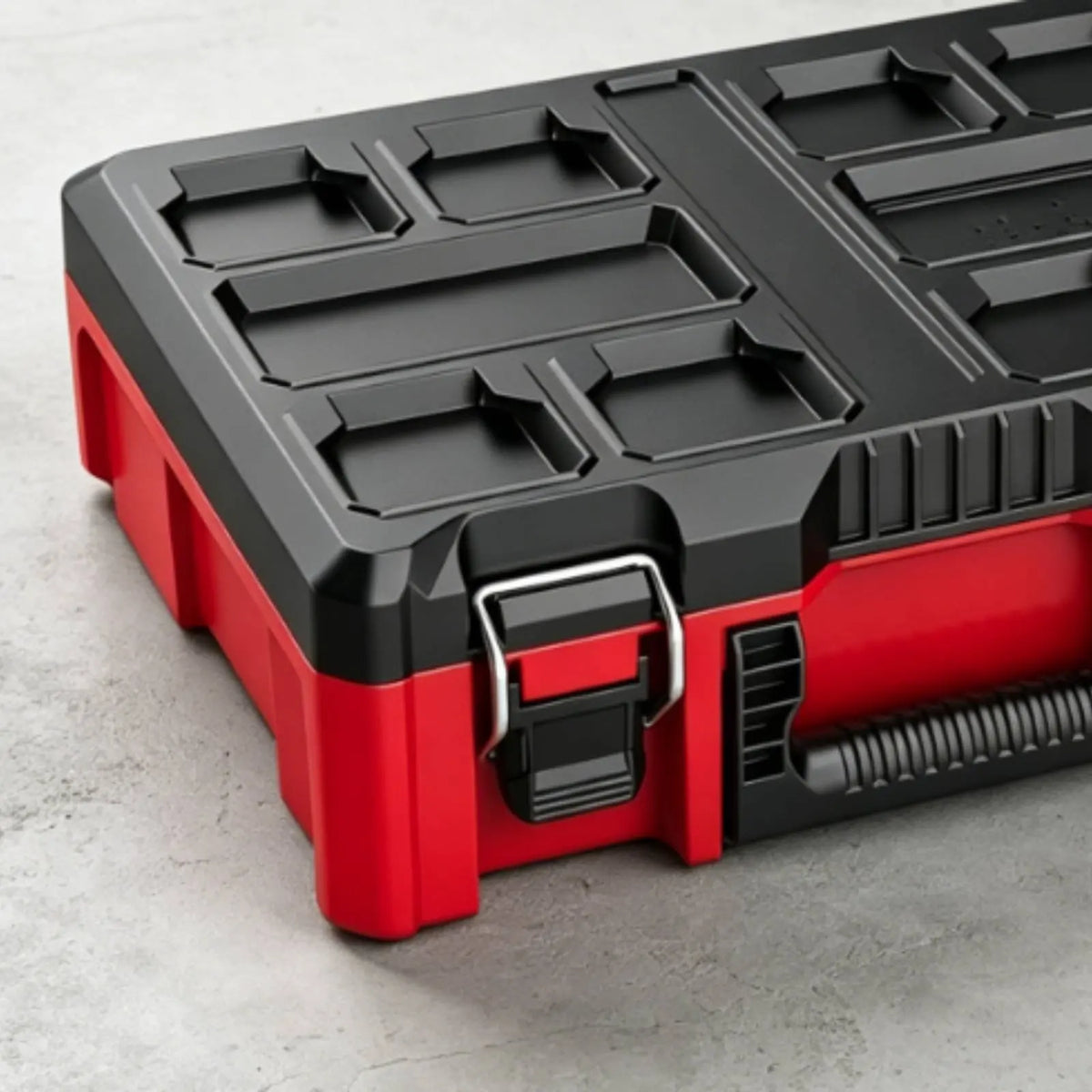 A red and black modular stackable tool organizer case with compartmentalized storage trays.