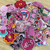A collection of pink themed embroidered cartoon iron-on patches featuring various shapes and designs.