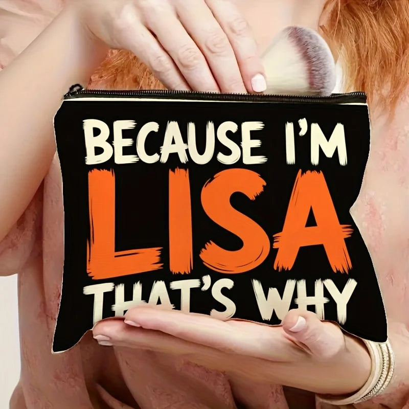 A hand holds an orange and white canvas makeup bag with the text Because I'm Lisa That's Why on it.