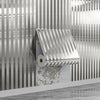 A close-up of a self-adhesive wood grain grille wall sticker in silver tones mounted on a textured wall.