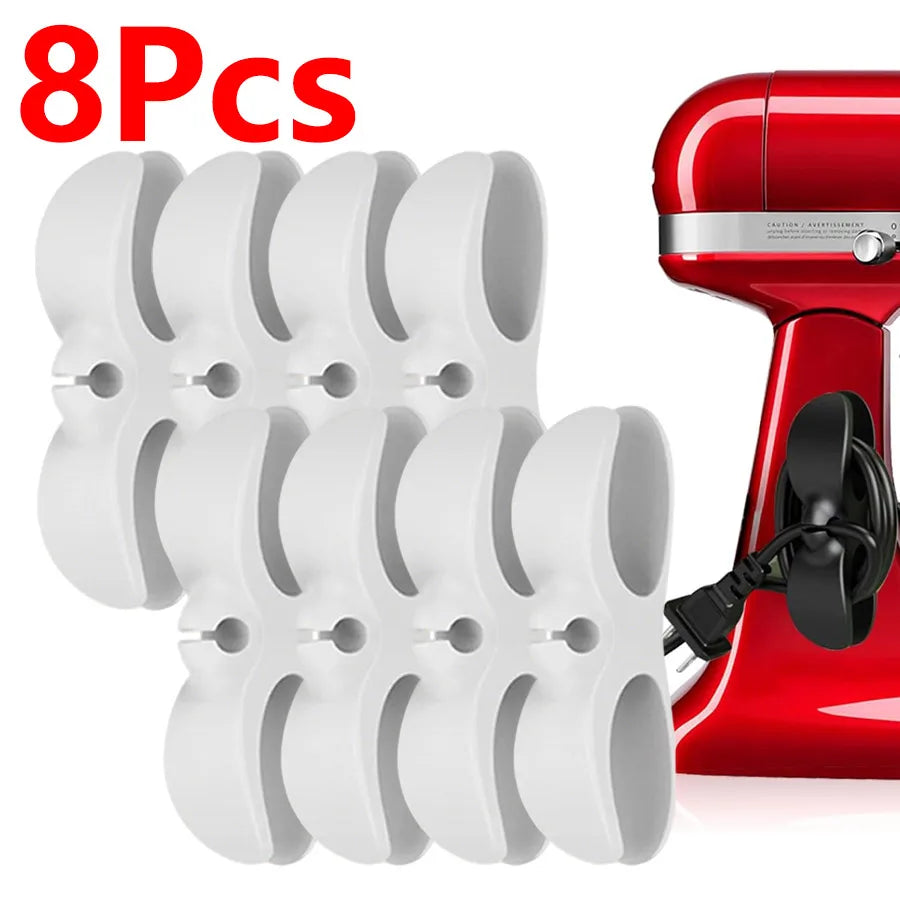 Eight white adhesive cord organizers for kitchen appliances shown next to a red appliance.