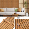 Roll of wood grain peel-and-stick wallpaper showing vertical stripes and natural wood texture.