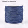 A roll of 0.8mm blue nylon cord for jewelry making and crafting.