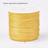 A spool of 0.8mm yellow nylon cord for jewelry making and crafting.