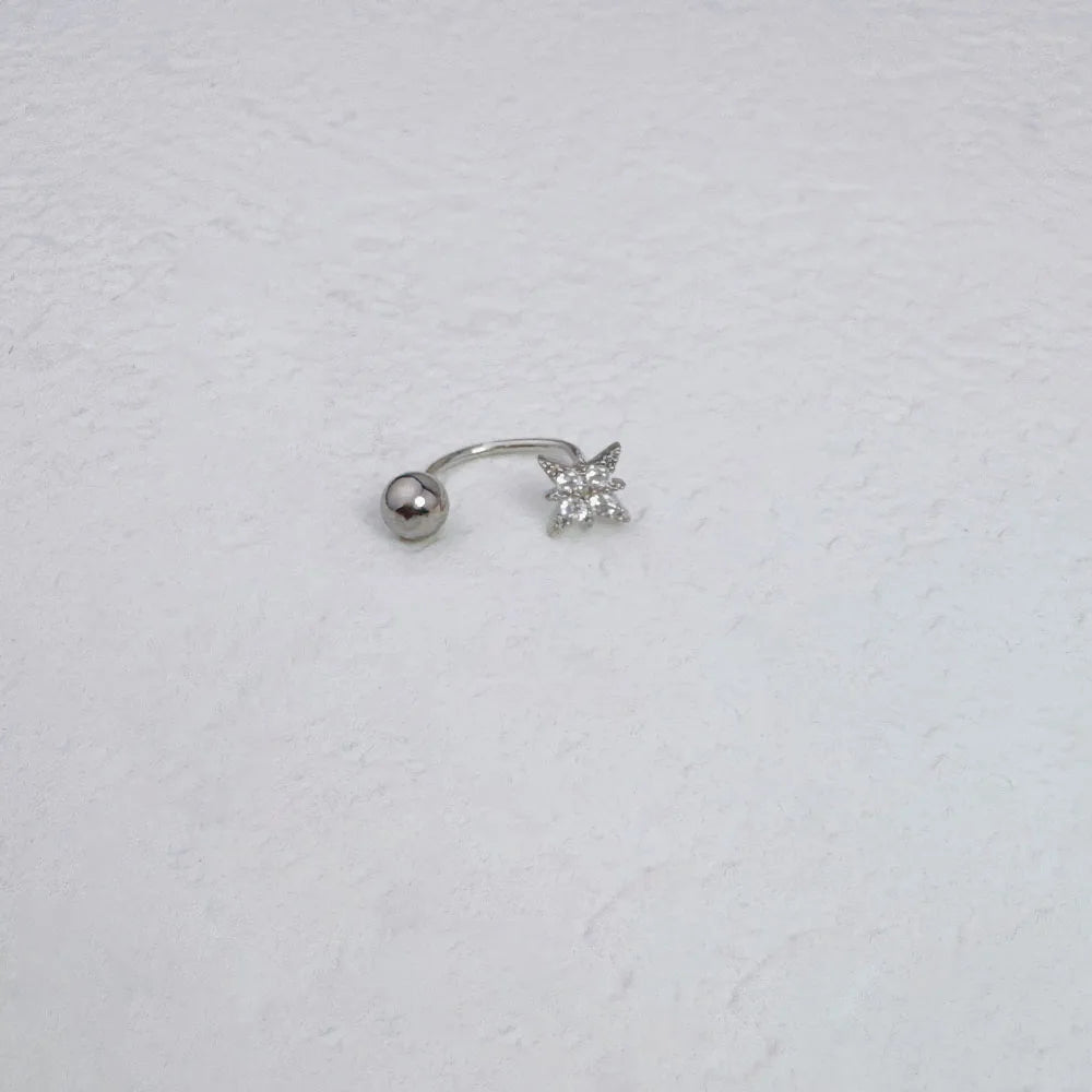 A silver nose ring featuring a zircon star design.