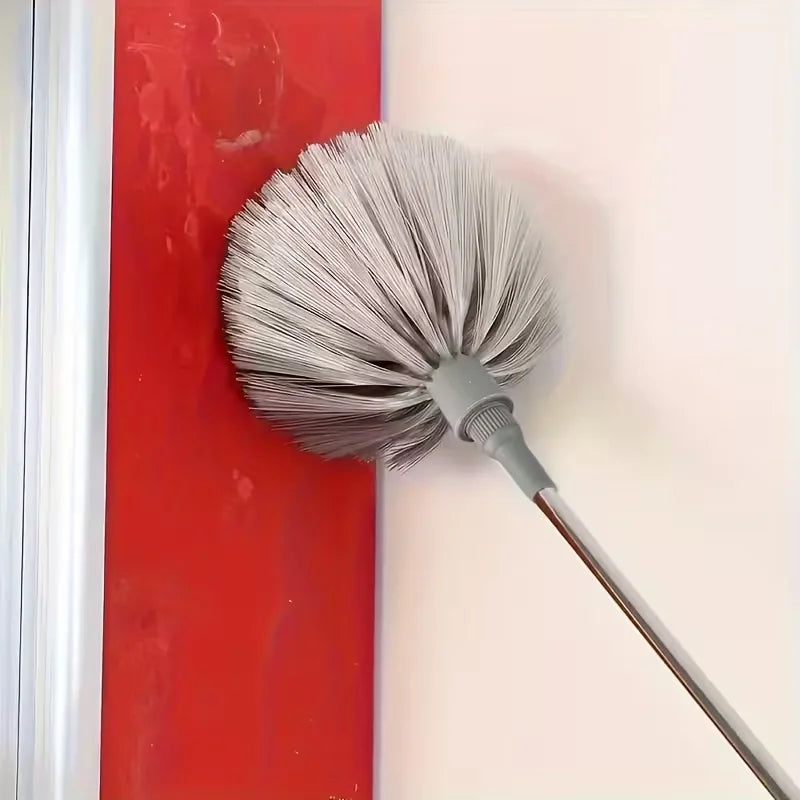 A gray adjustable spider web ceiling cleaner with a microfiber head is shown against a red and white background.