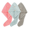 Three folded ultra-soft microfiber hair drying towels in pink, mint green, and gray.