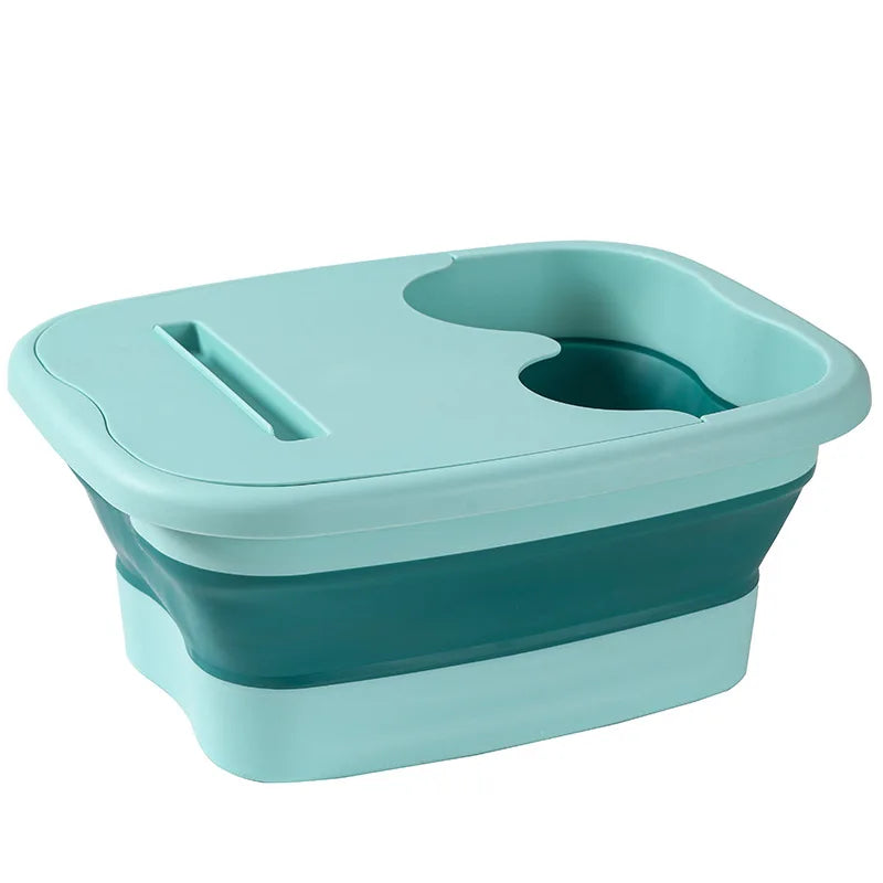 A teal collapsible foot spa bucket with a contoured design for massage and soaking.