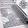 A close-up of a metal shower mat with numerous drainage holes and massage points designed to wash hair away quickly.